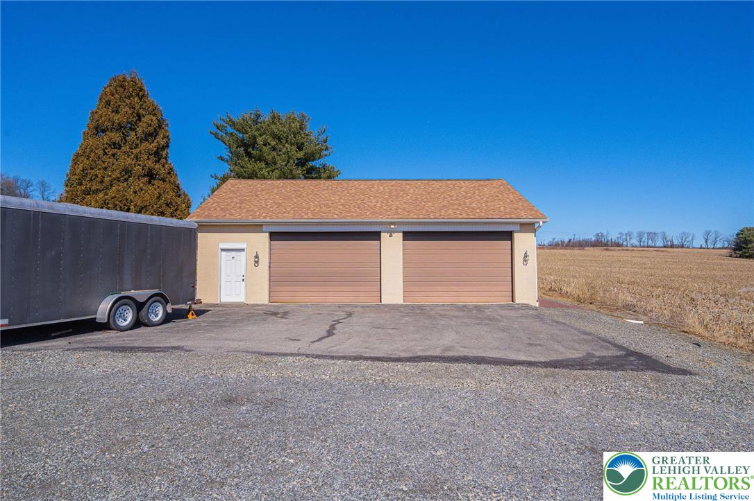 6245 Vera Cruz Road Emmaus, PA 18049 - Photo 70 of 72 a front view of a house with parking space