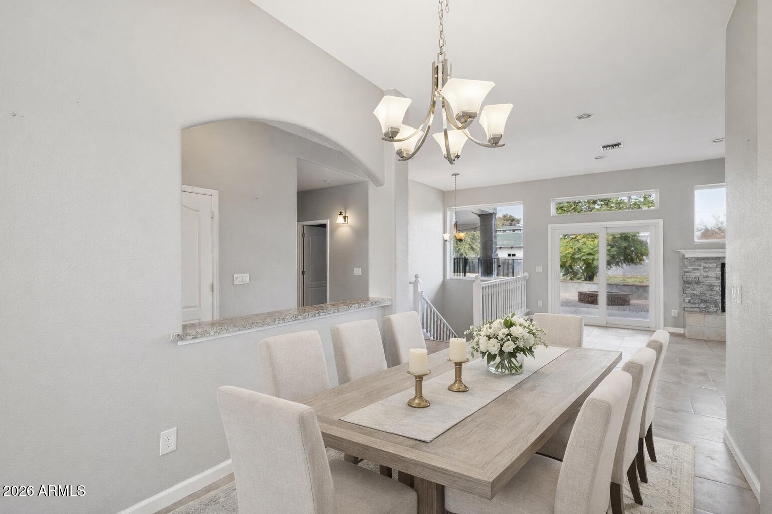 702 West Why Worry Lane Phoenix, AZ 85021 - Photo 6 of 53 a view of a dining room with furniture wooden floor and chandelier
