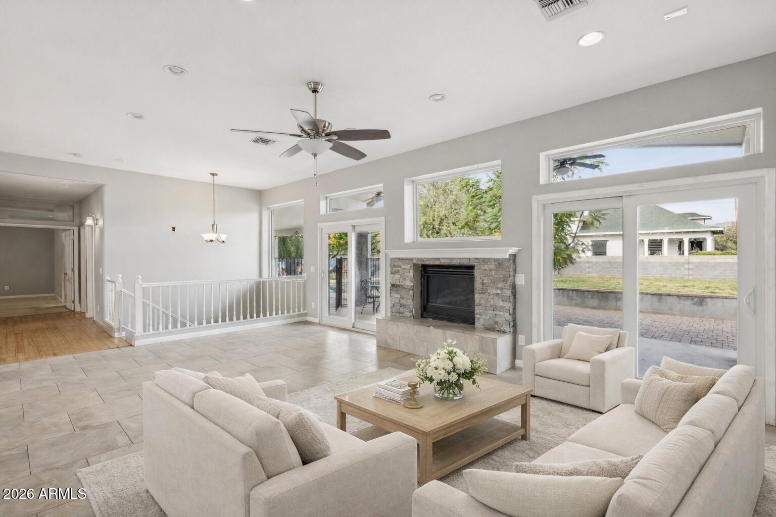 702 West Why Worry Lane Phoenix, AZ 85021 - Photo 8 of 53 a living room with furniture and a fireplace