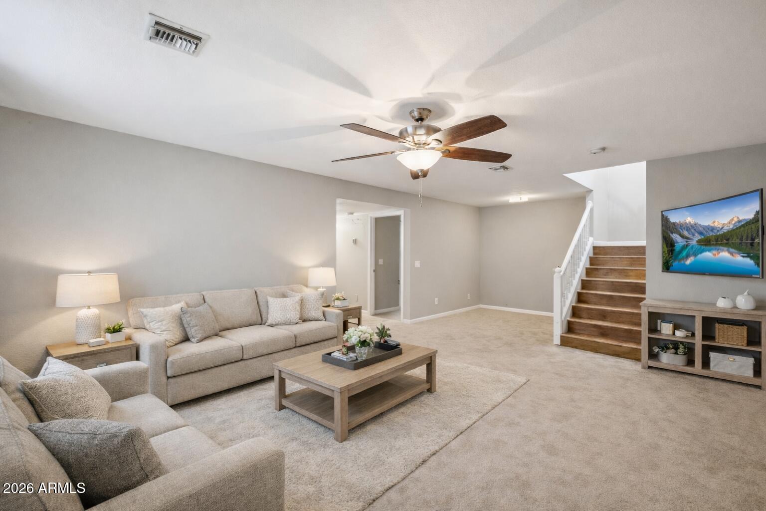 702 West Why Worry Lane Phoenix, AZ 85021 - Photo 18 of 34 a living room with furniture and a chandelier