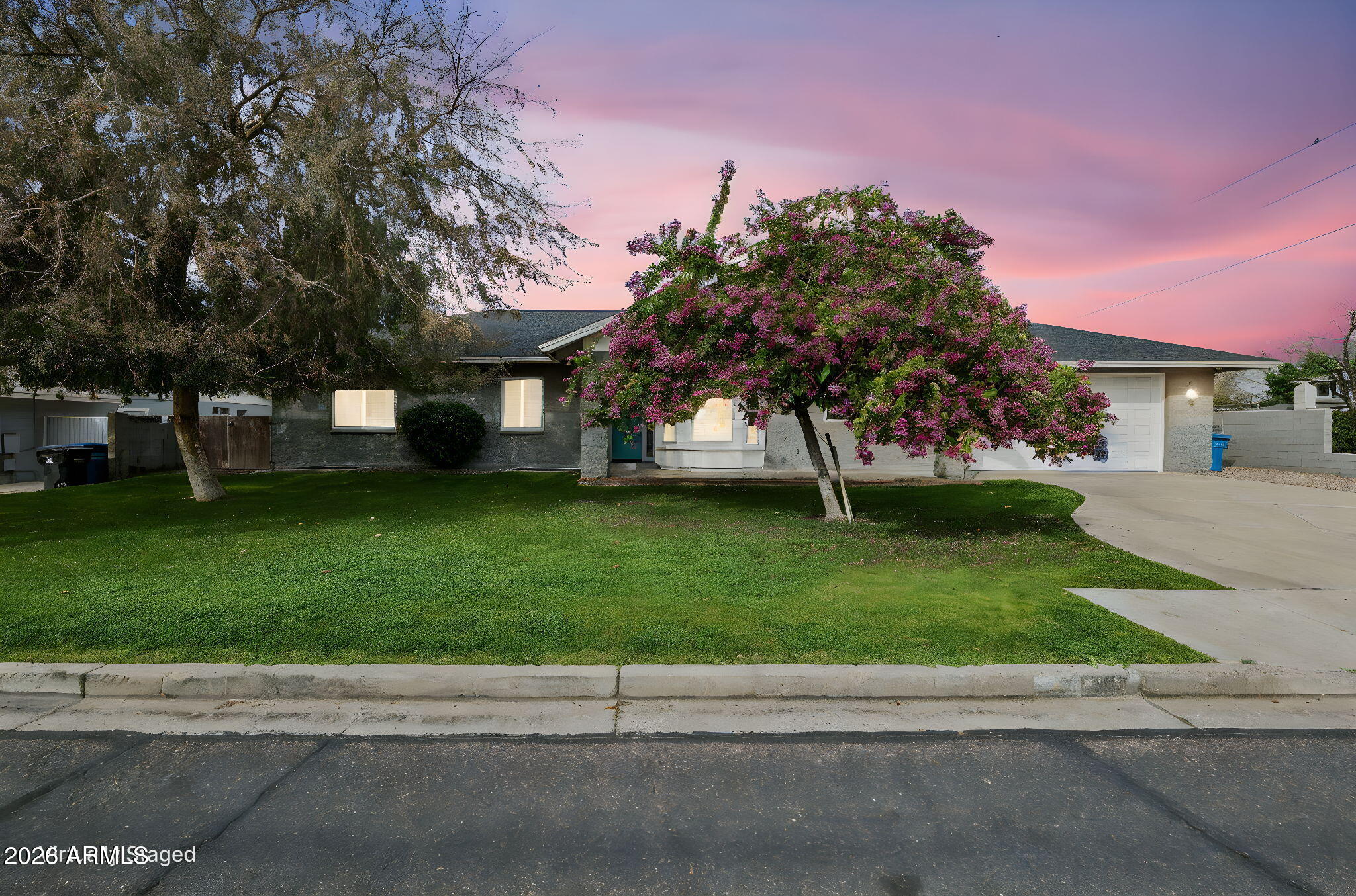 702 West Why Worry Lane Phoenix, AZ 85021 - Photo 2 of 53 a view of a house with a yard