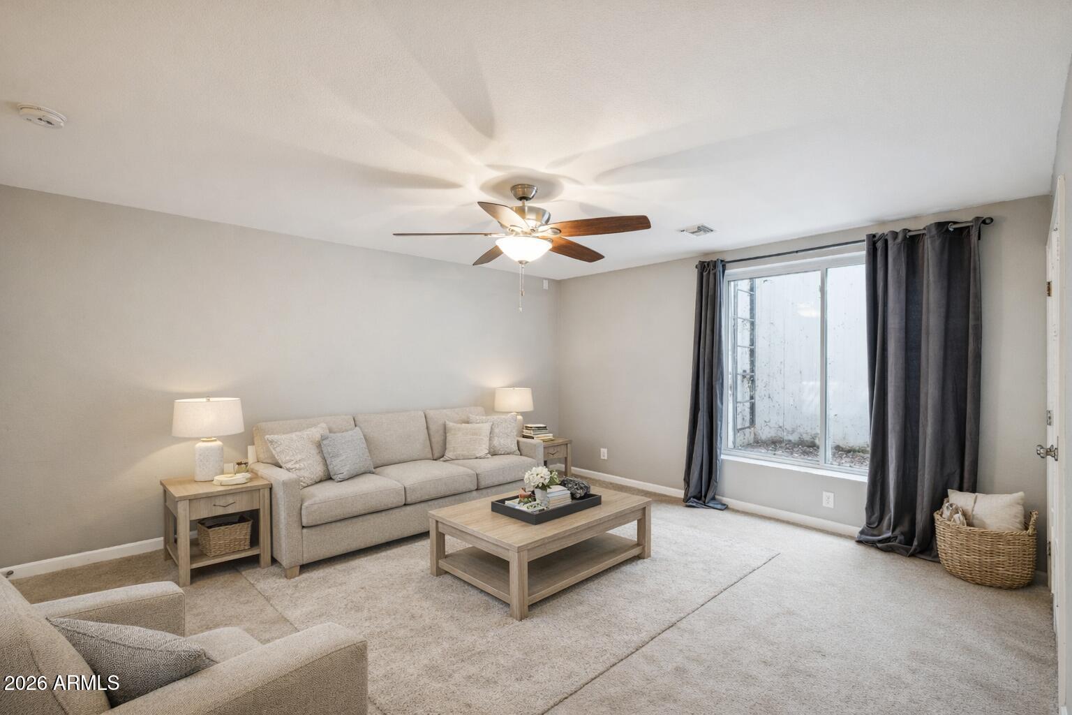 702 West Why Worry Lane Phoenix, AZ 85021 - Photo 27 of 53 a living room with furniture and a large window