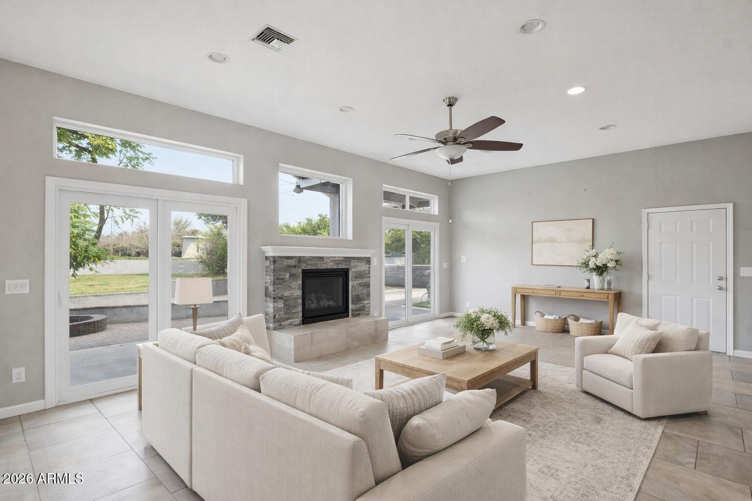 702 West Why Worry Lane Phoenix, AZ 85021 - Photo 4 of 53 a living room with furniture fireplace and a large window