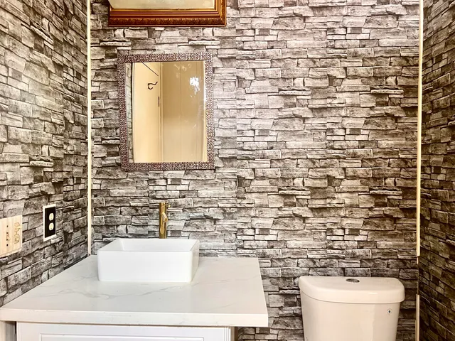 a bathroom with a toilet and a sink