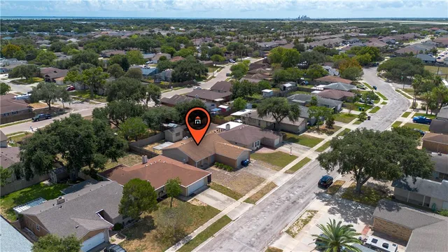 an aerial view of a house with a garden
