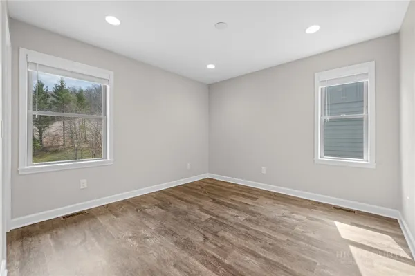 a view of empty room with windows