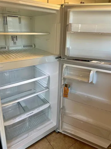 a view of storage and utility room with racks on wall