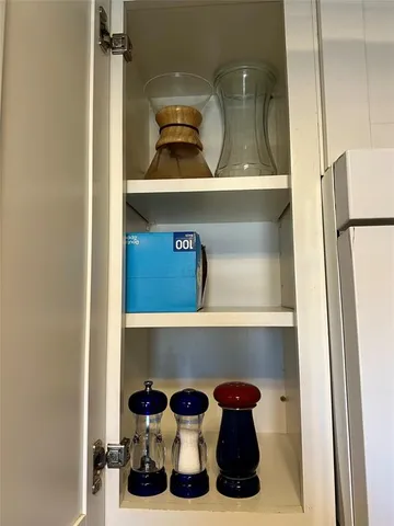 a kitchen with a refrigerator and cabinets