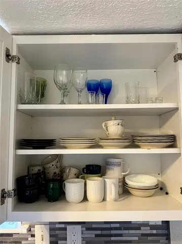 a shelf of a blue and white vase