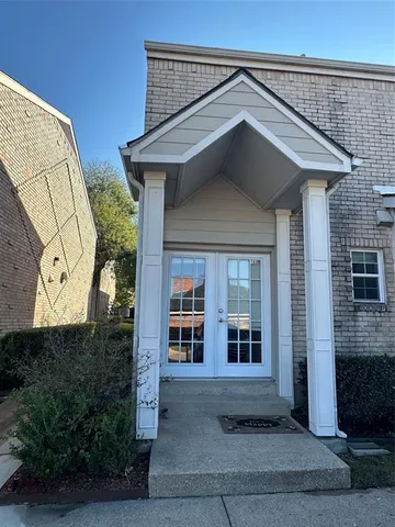 a view of a house with large windows