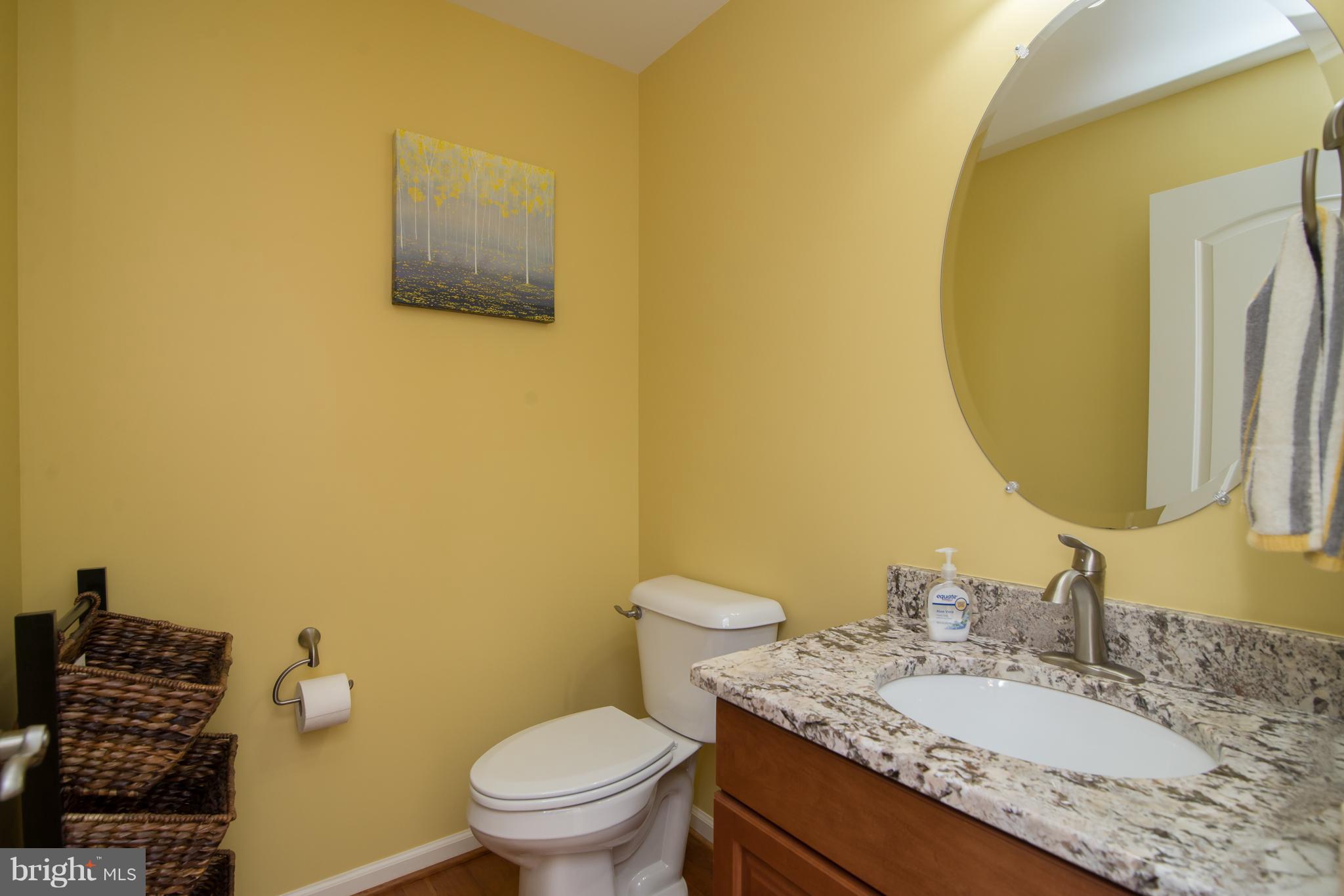 41 Houston Road Inwood, WV 25428 - Photo 6 of 30 a bathroom with a granite countertop toilet sink and mirror