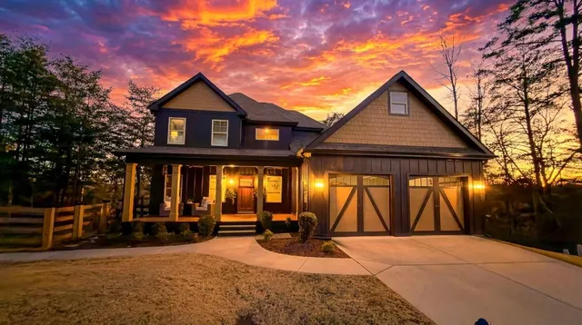 a view of house with outdoor space and porch