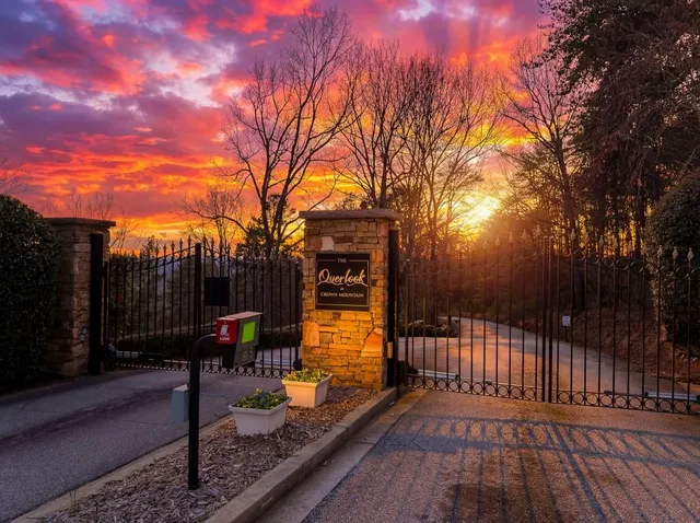 a view of a patio with wooden fence