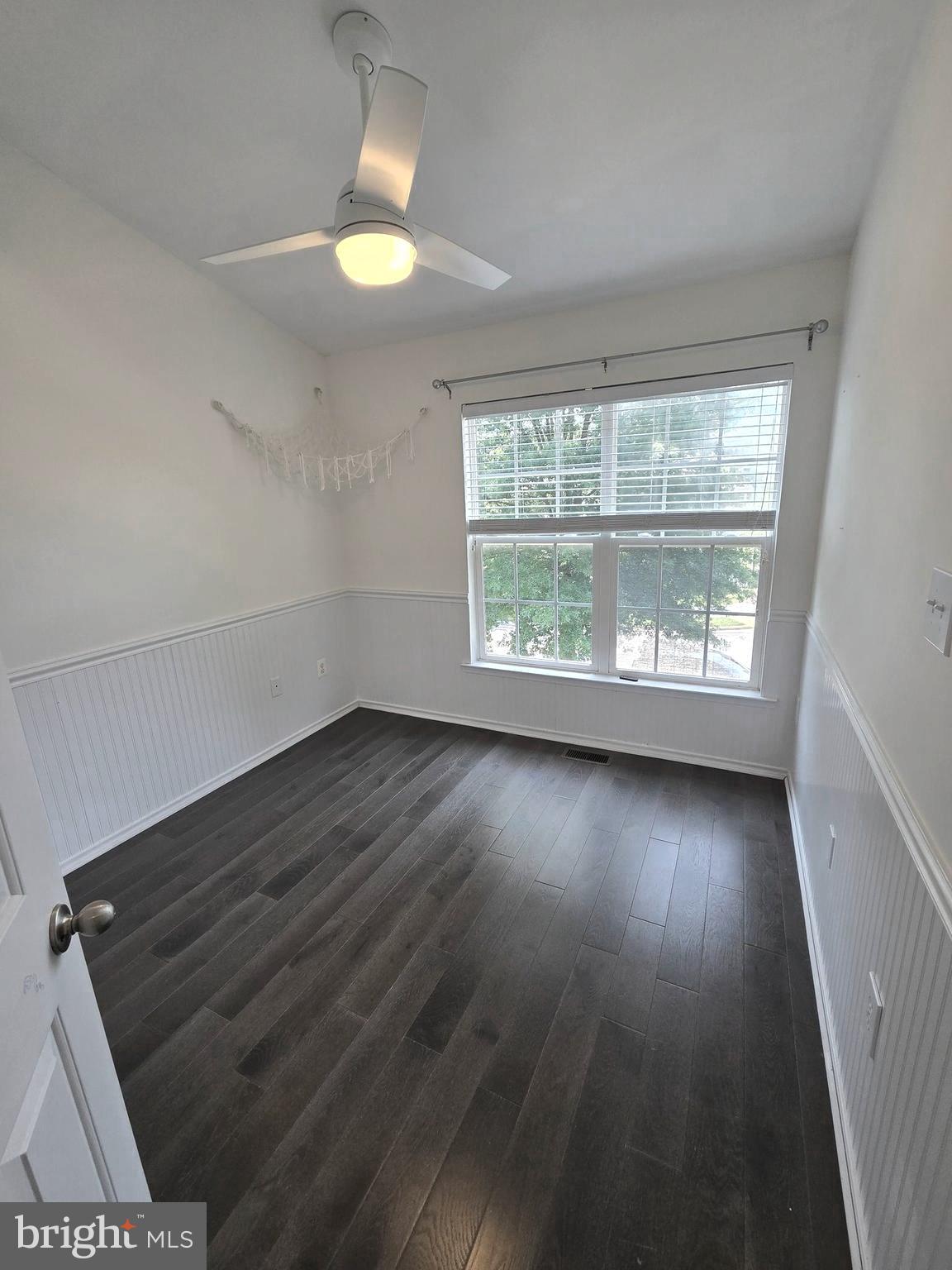 11847 Skylark Road Clarksburg, MD 20871 - Photo 22 of 46 an empty room with wooden floor and windows