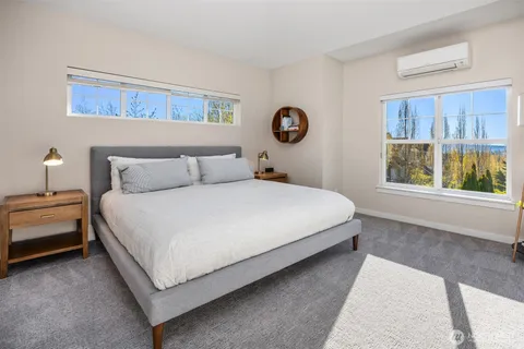 a bedroom with a bed and window