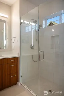 a bathroom with a shower and a sink