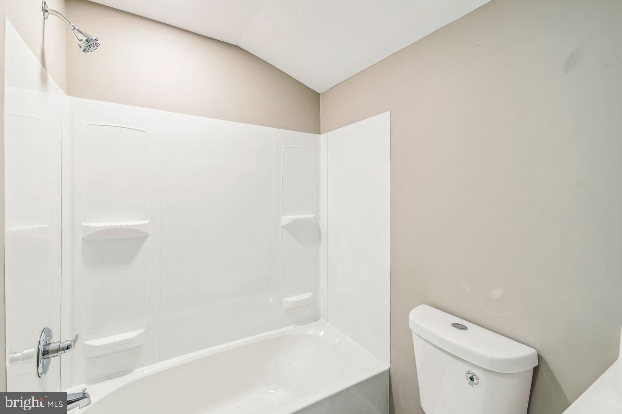 4912 Ocean Gateway Vienna, MD 21869 - Photo 21 of 35 a bathroom with a bathtub and a toilet