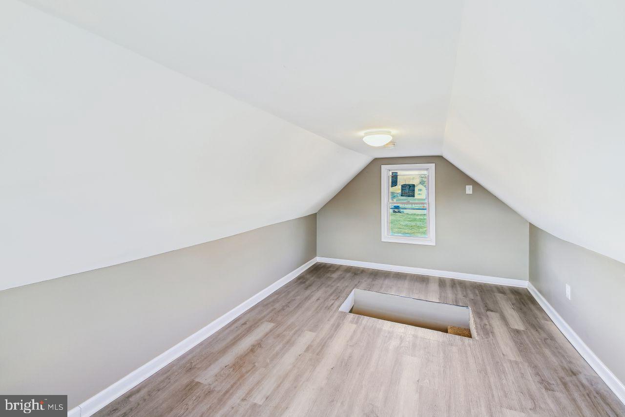 4912 Ocean Gateway Vienna, MD 21869 - Photo 31 of 35 a view of an empty room with wooden floor and a window