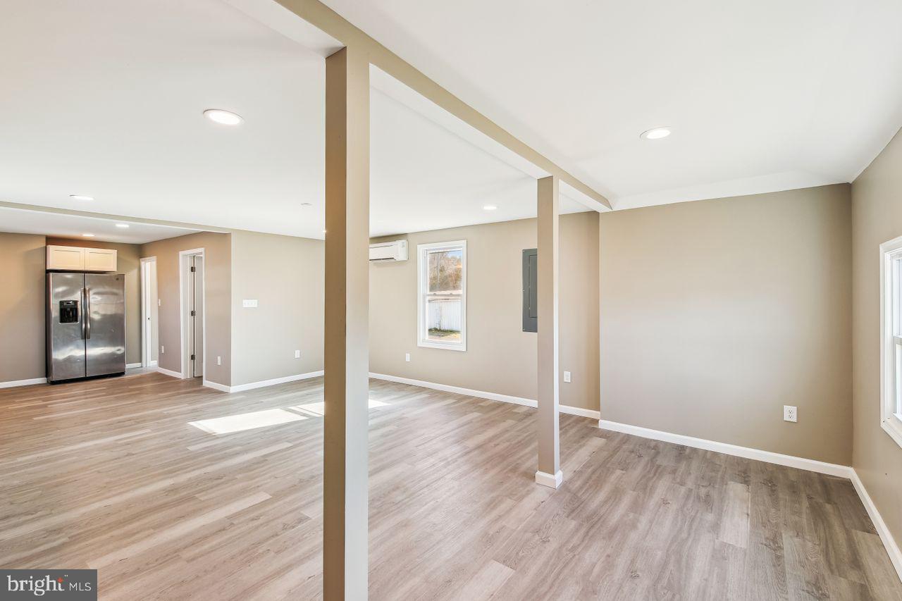 4912 Ocean Gateway Vienna, MD 21869 - Photo 4 of 35 a view of a big room with wooden floor and windows