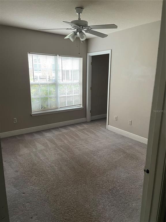 4356 South Kirkman Road, Unit 501 Orlando, FL 32811 - Photo 11 of 19 a view of an empty room with a window