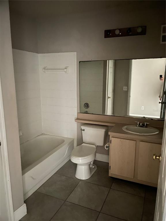 4356 South Kirkman Road, Unit 501 Orlando, FL 32811 - Photo 13 of 19 a bathroom with a sink a toilet and shower