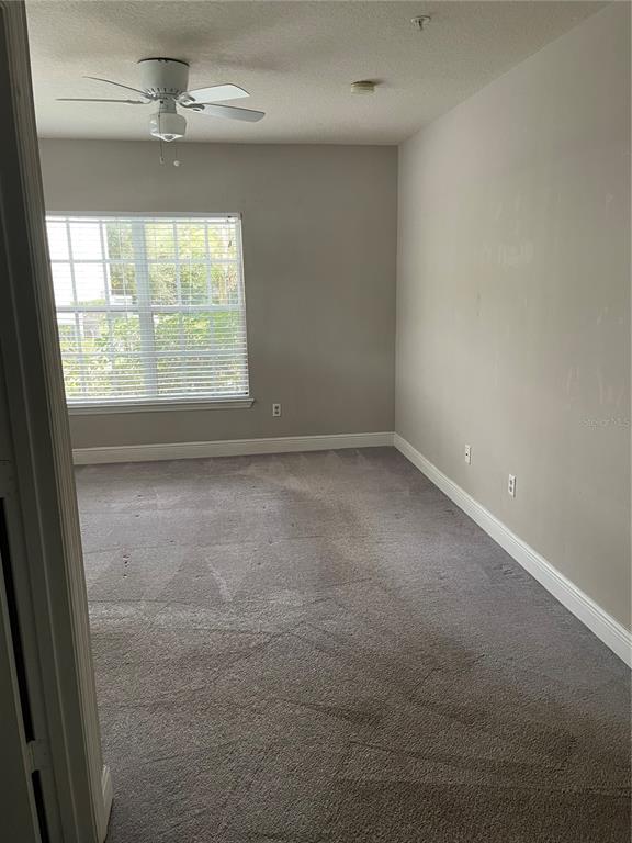 4356 South Kirkman Road, Unit 501 Orlando, FL 32811 - Photo 16 of 19 an empty room with a window