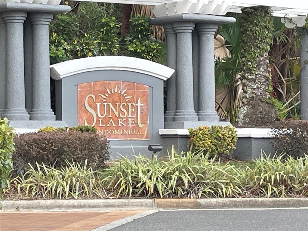 4356 South Kirkman Road, Unit 501 Orlando, FL 32811 - Photo 19 of 19 a front view of a house with garden