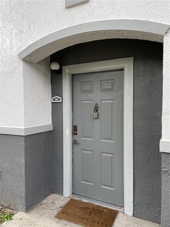 4356 South Kirkman Road, Unit 501 Orlando, FL 32811 - Photo 3 of 19 a bathroom with a sink and mirror