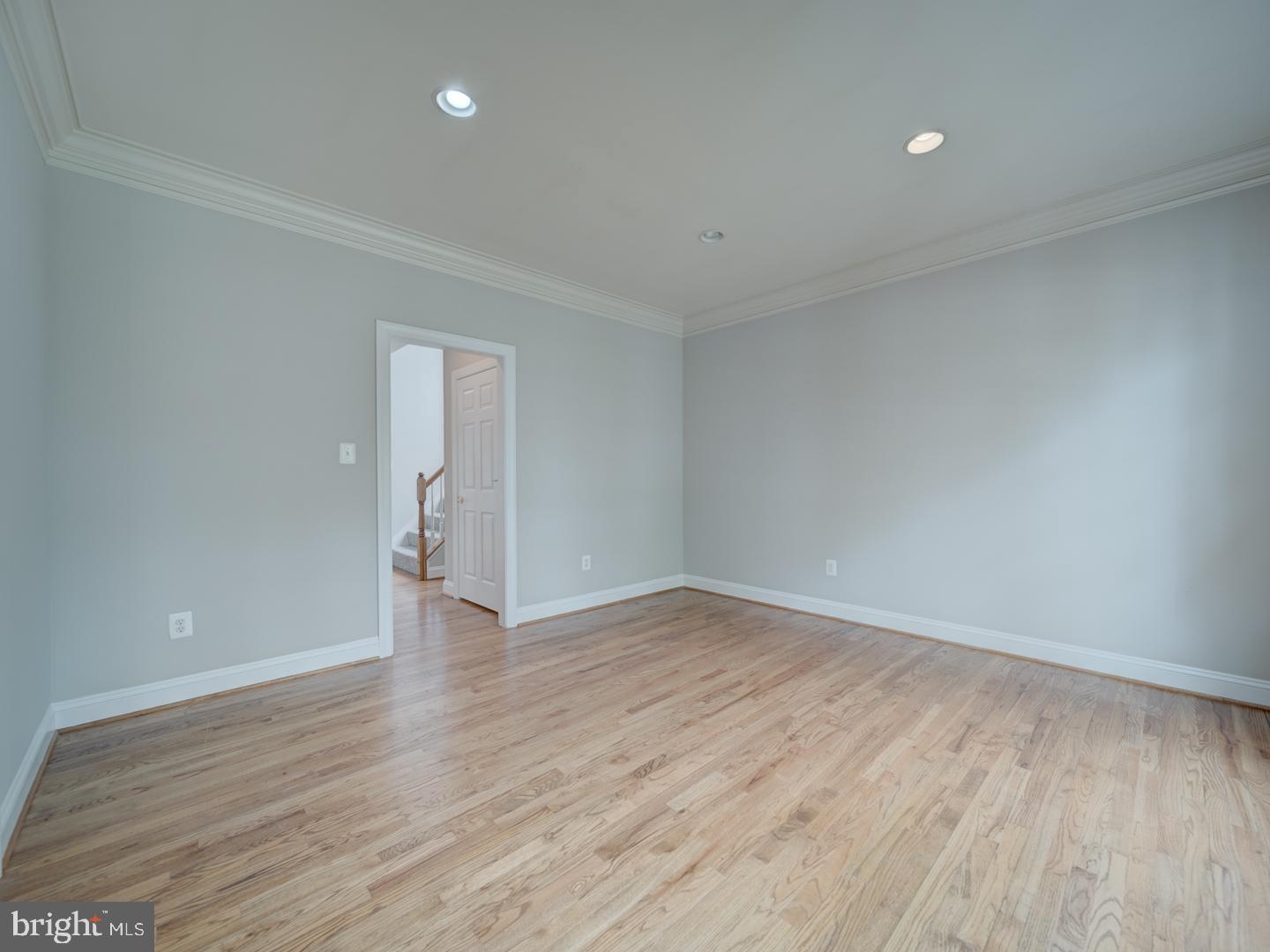 8429 Link Hills Loop Gainesville, VA 20155 - Photo 13 of 102 a view of an empty room with wooden floor and a window