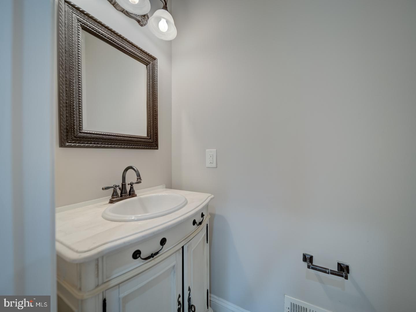 8429 Link Hills Loop Gainesville, VA 20155 - Photo 21 of 102 a bathroom with a sink and a mirror