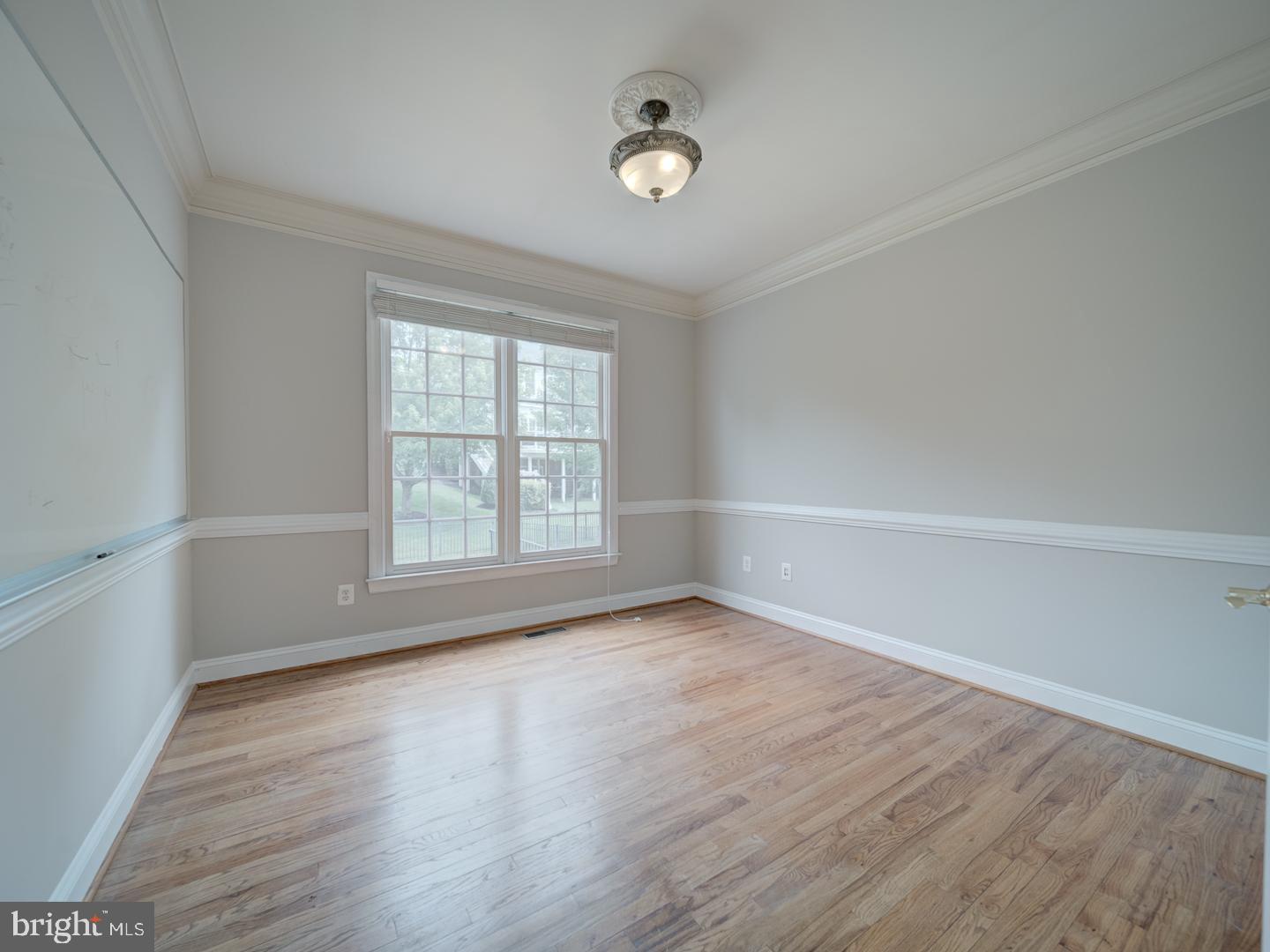 8429 Link Hills Loop Gainesville, VA 20155 - Photo 23 of 102 wooden floor in an empty room with a window