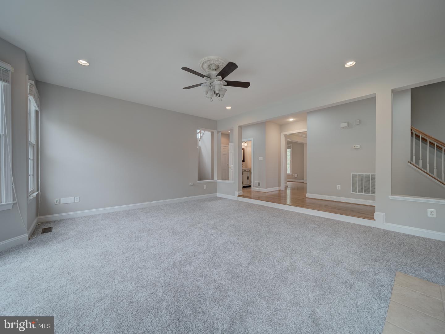 8429 Link Hills Loop Gainesville, VA 20155 - Photo 32 of 102 a view of a livingroom with a ceiling fan and window