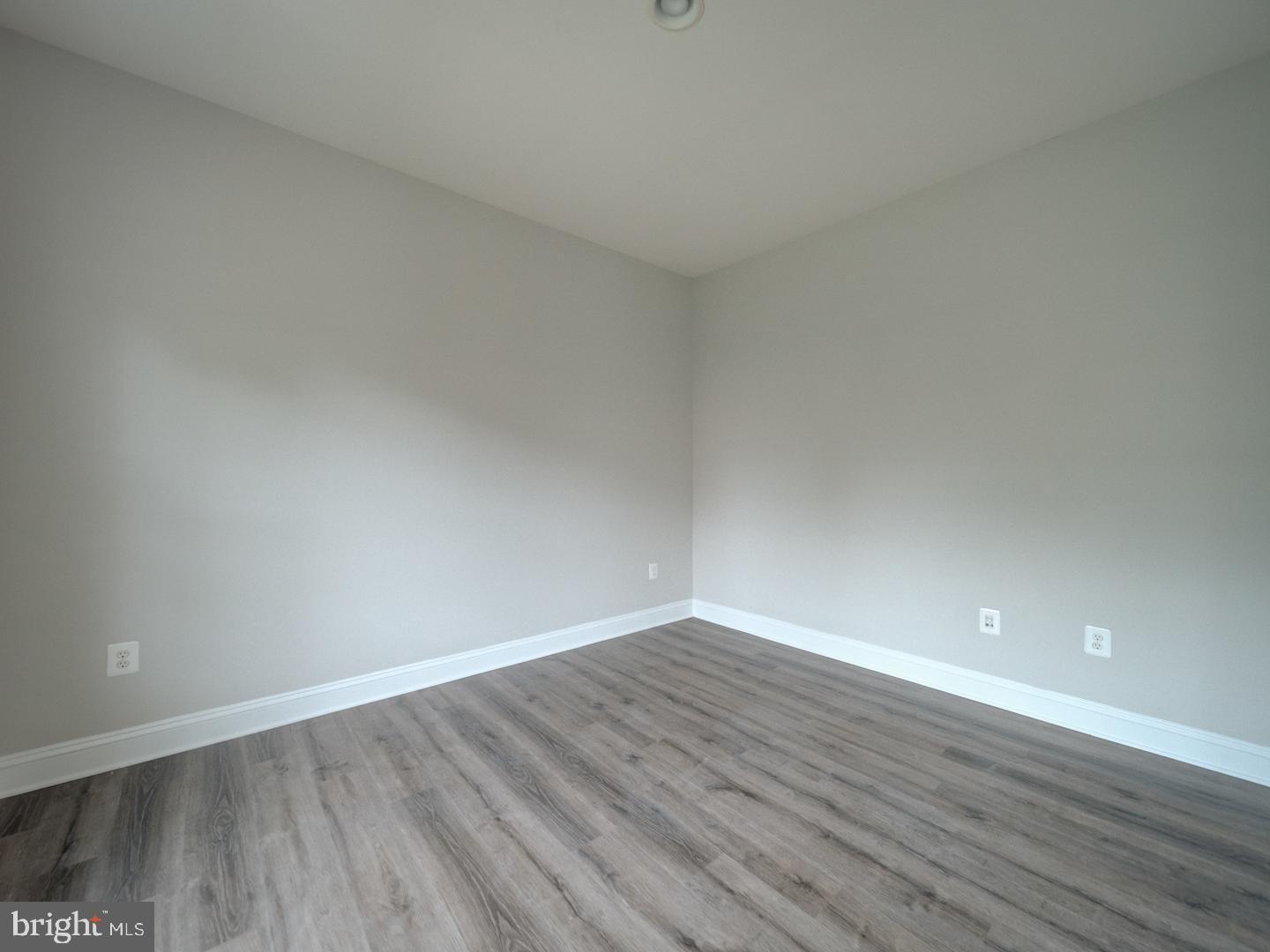 8429 Link Hills Loop Gainesville, VA 20155 - Photo 56 of 102 a view of an empty room with wooden floor