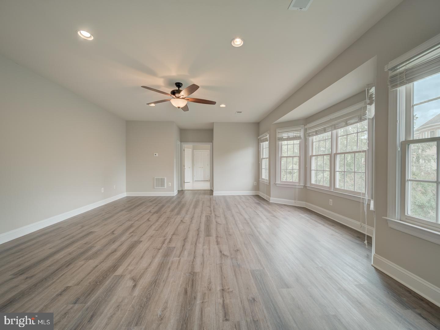8429 Link Hills Loop Gainesville, VA 20155 - Photo 57 of 102 wooden floor in an empty room with a window