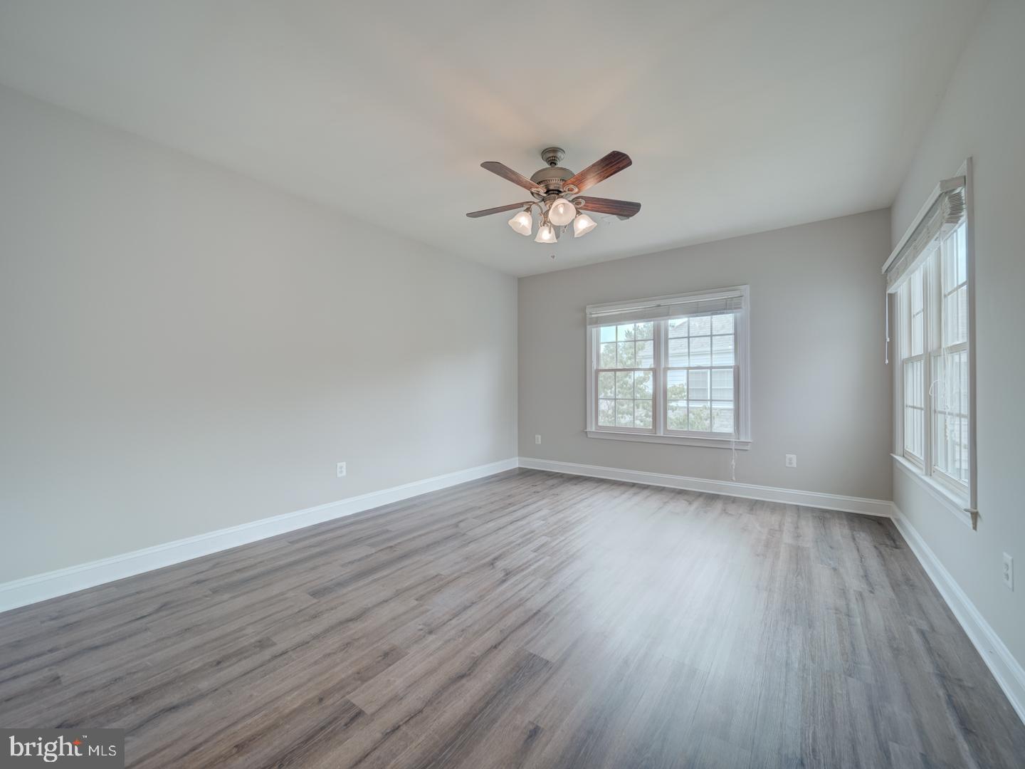 8429 Link Hills Loop Gainesville, VA 20155 - Photo 70 of 102 wooden floor in an empty room with a window