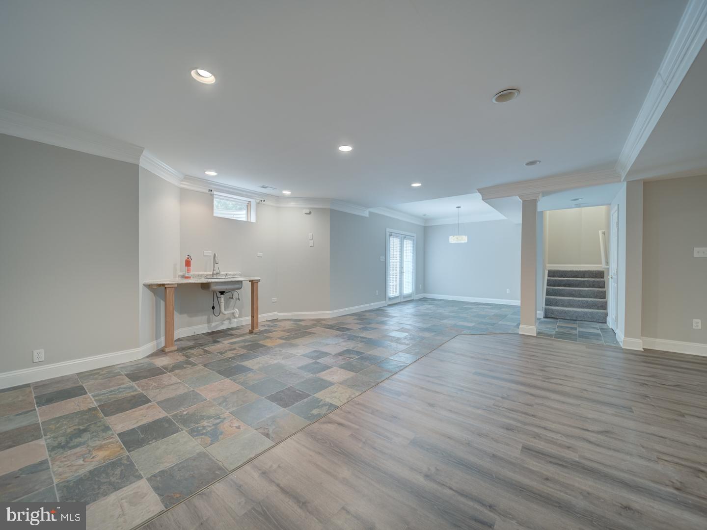 8429 Link Hills Loop Gainesville, VA 20155 - Photo 84 of 102 a view of an empty room with wooden floor