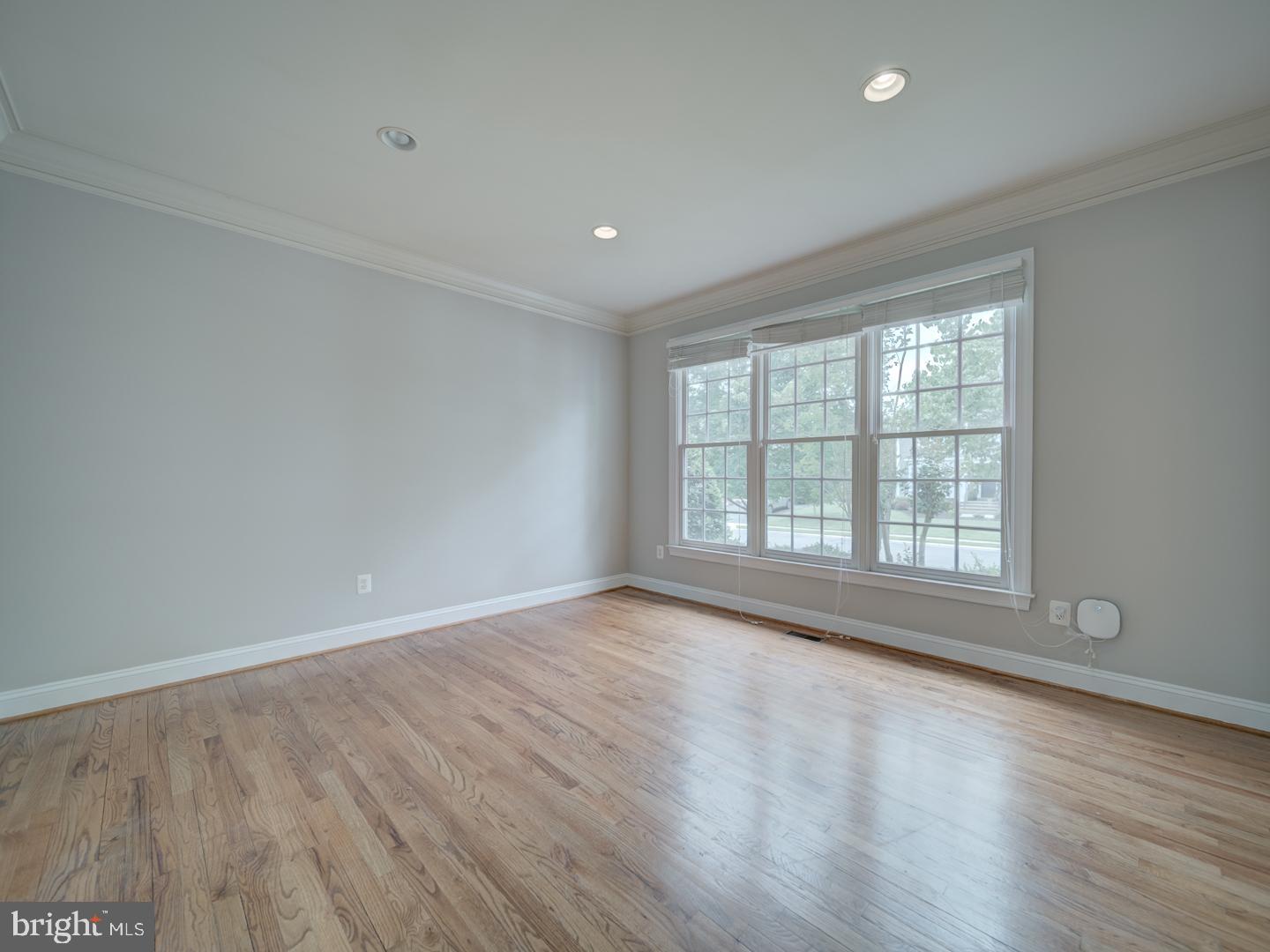 8429 Link Hills Loop Gainesville, VA 20155 - Photo 10 of 102 wooden floor in an empty room with a window