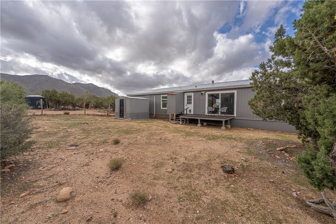 2765 North Silver Springs Road Kingman, AZ 86401 - Photo 57 of 60 a view of house with yard and sitting area