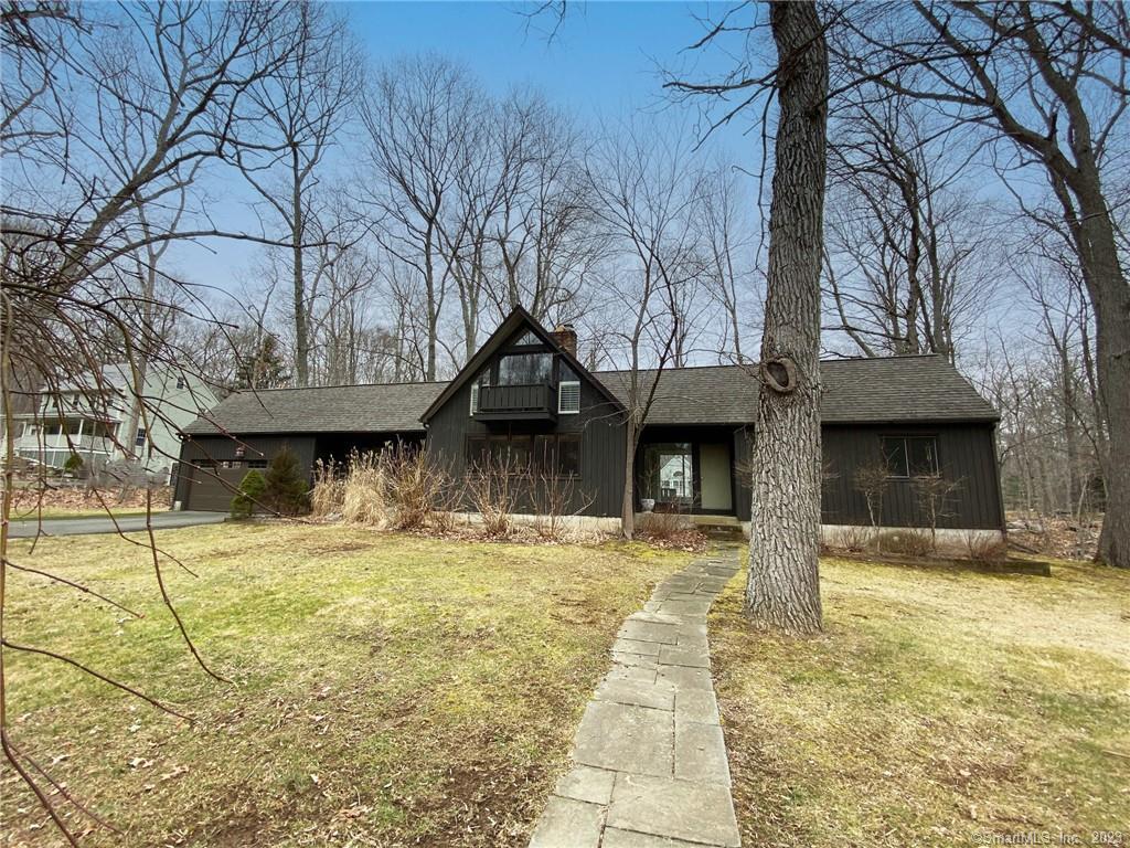 84 Forest Brook Road Guilford, CT 06437 - Photo 1 of 1 a house with trees in the background