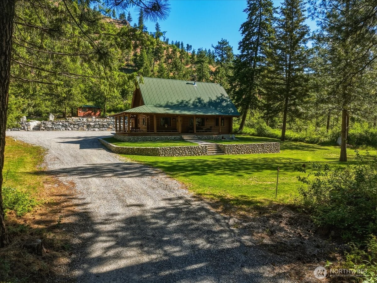 2250 First Crk Road Chelan, WA 98816 - Photo 3 of 39 a view of a house with a yard and a large tree