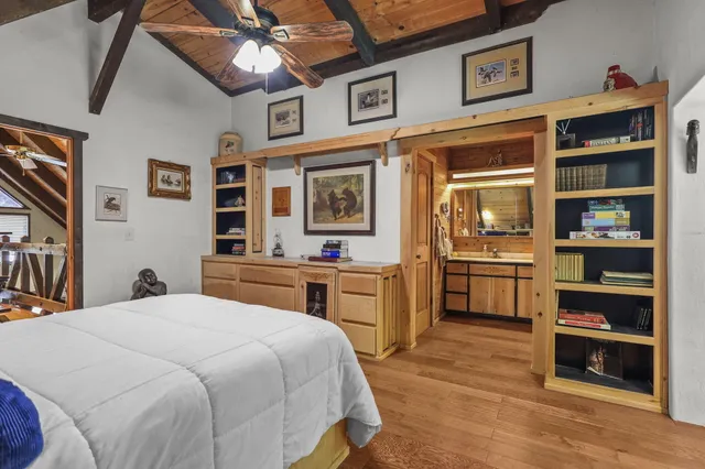 a bathroom with a double vanity sink and a large mirror