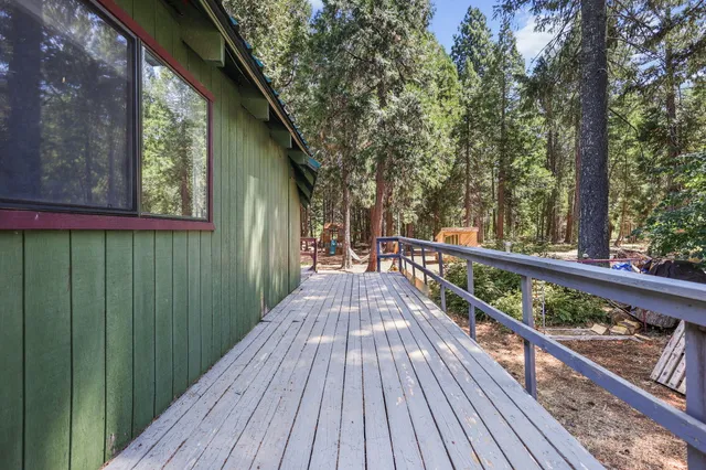 a view of a chairs and table in the patio