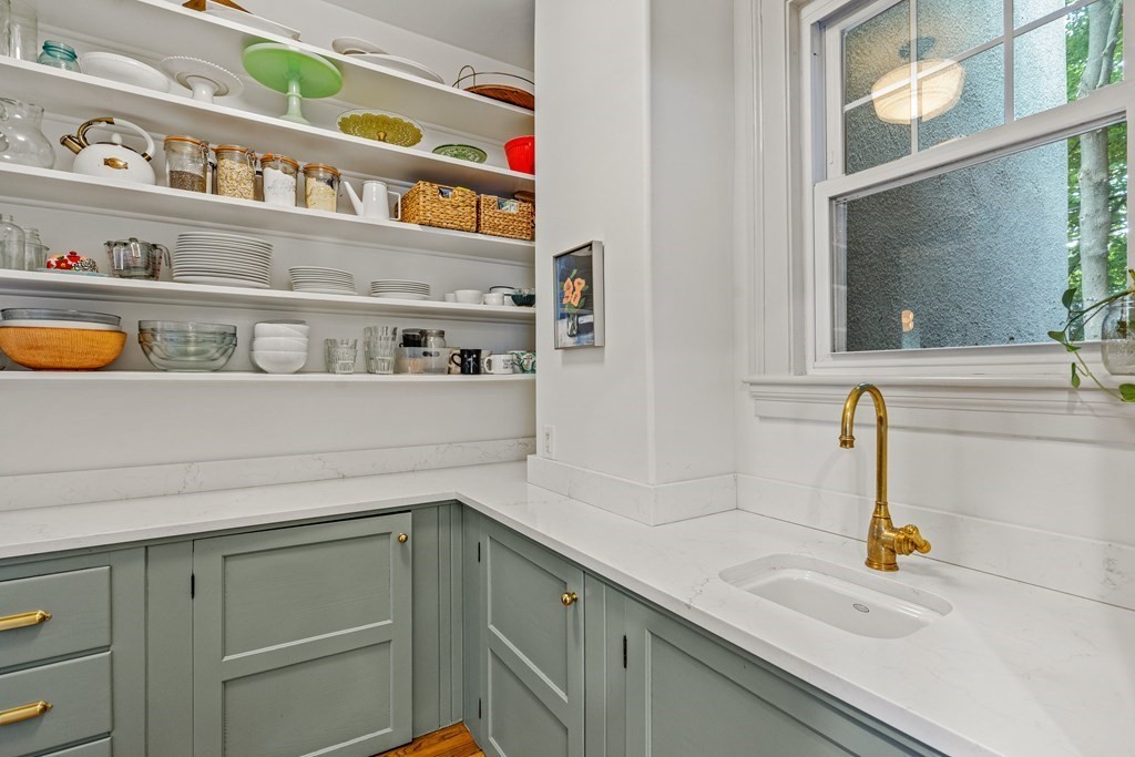 19 Edgehill Road Winchester, MA 01890 - Photo 18 of 42 a kitchen with a sink and a stove with cabinets