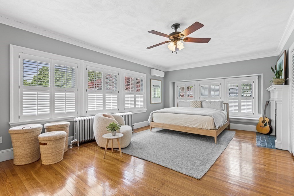 19 Edgehill Road Winchester, MA 01890 - Photo 27 of 42 a bedroom with a bed and a chandelier