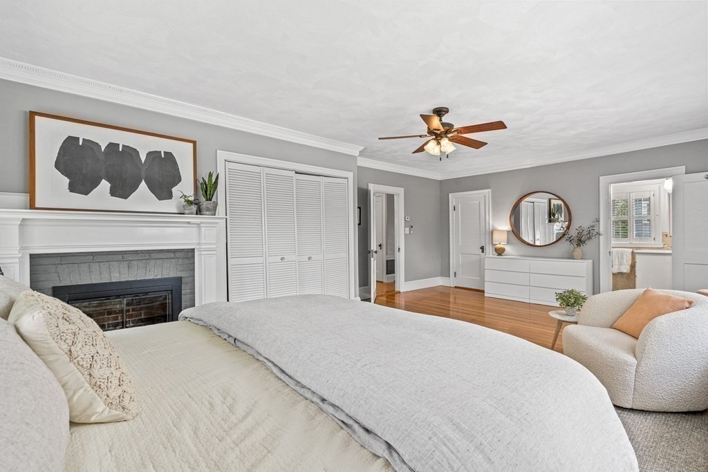 19 Edgehill Road Winchester, MA 01890 - Photo 29 of 42 a bed room with a bed and a fireplace