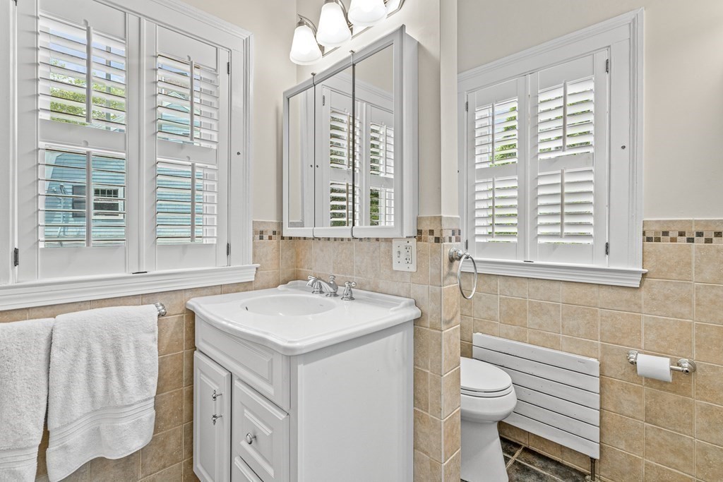 19 Edgehill Road Winchester, MA 01890 - Photo 30 of 42 a bathroom with a sink and a toilet