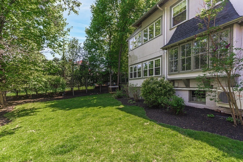 19 Edgehill Road Winchester, MA 01890 - Photo 3 of 42 a view of backyard with table and chairs and potted plants