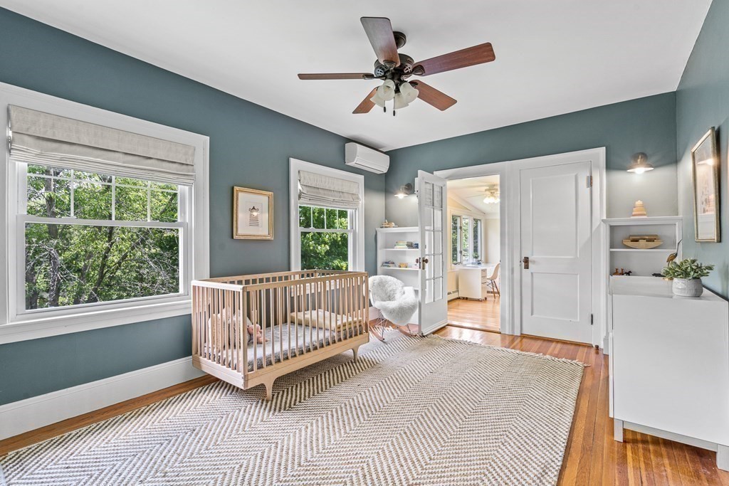 19 Edgehill Road Winchester, MA 01890 - Photo 34 of 42 a living room with a bed furniture and a window