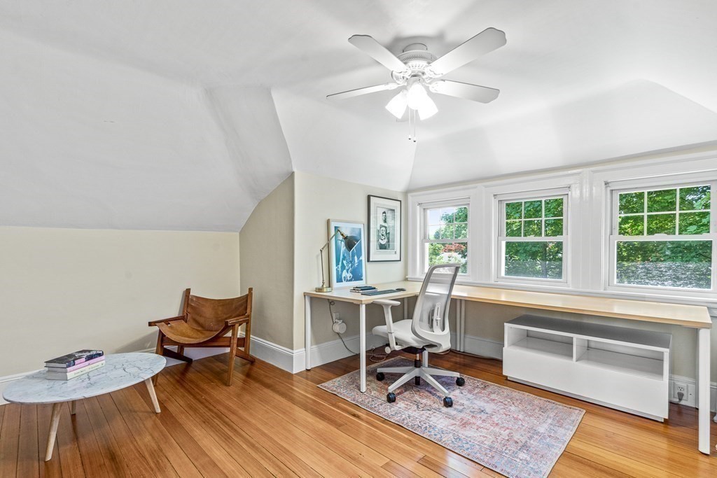 19 Edgehill Road Winchester, MA 01890 - Photo 39 of 42 a workspace with wooden floor and a rug