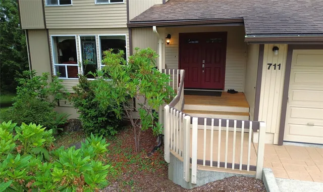 a front view of a house with a porch